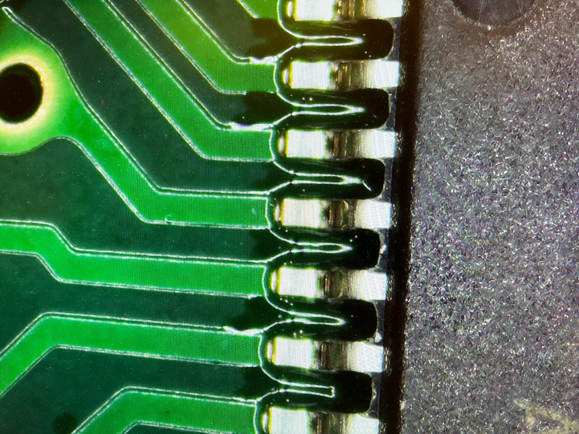 Technician testing a PCB with oscilloscope